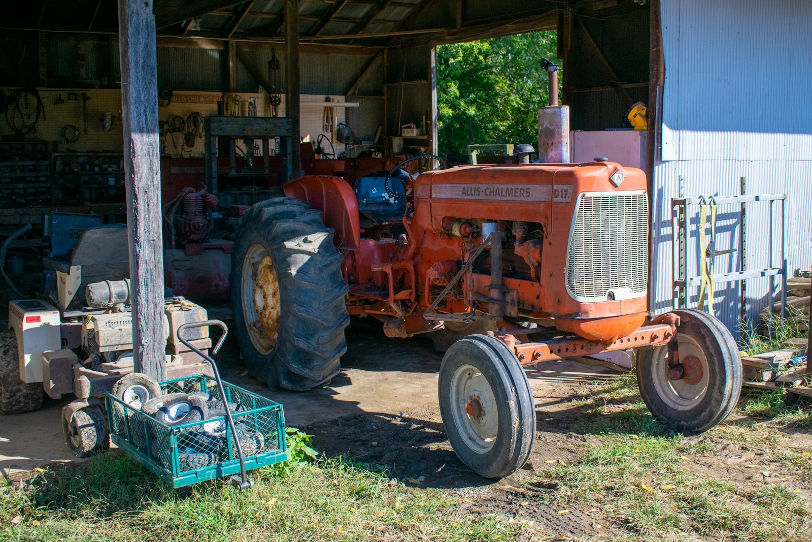 a tractor parked in front of a shed